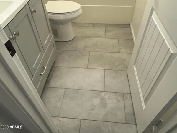 a bathroom with a sink and toilet