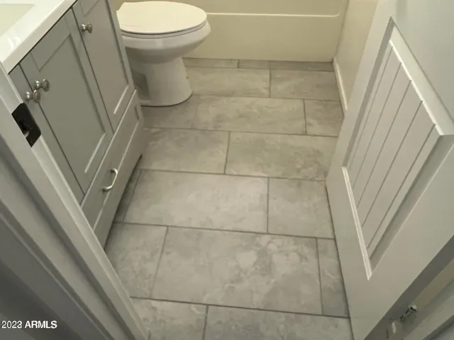 a bathroom with a sink and toilet