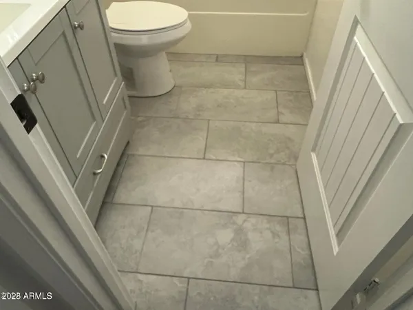 a bathroom with a sink and toilet