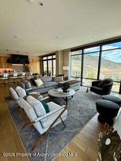77 Wood Road, Unit 50711 Snowmass Village, CO 81615 - Photo 4 of 20 a living room with furniture and a flat screen tv