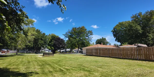 a swimming pool with outdoor seating and yard