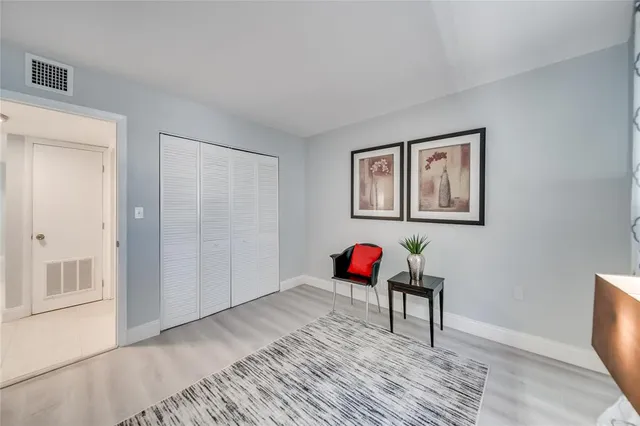 a spacious bedroom with a bed and a closet