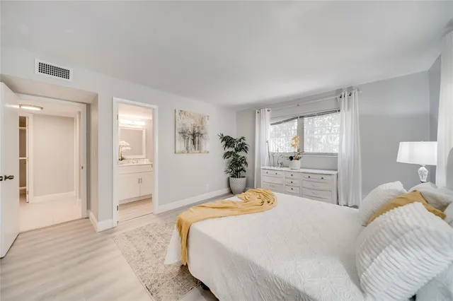 a bedroom with a bed and a table in it