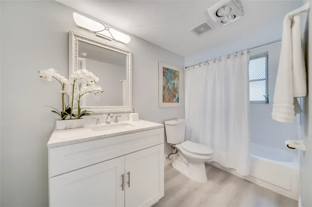 a view of staircase with white walls and windows