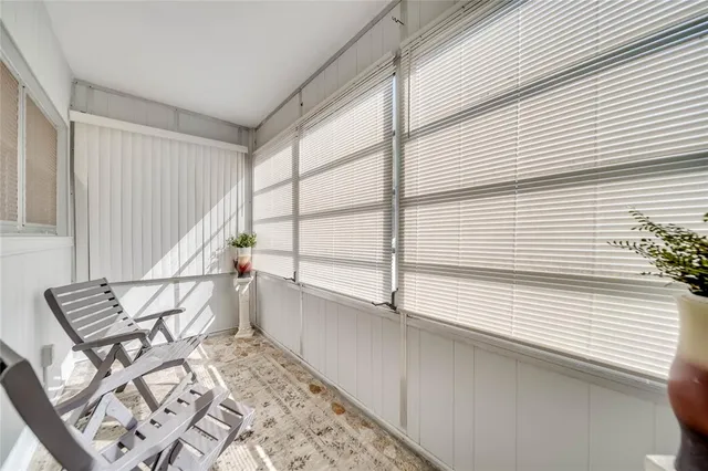 a view of chair and table in wooden floor