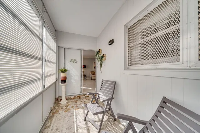 a view of a hallway with wooden shelves