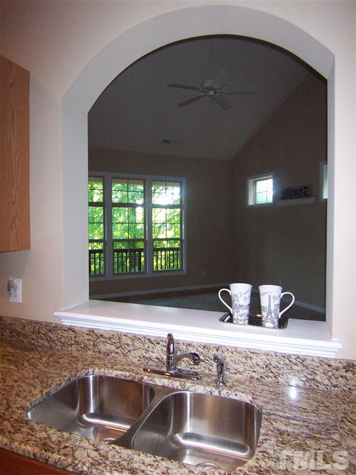6157 Blakeman Lane Raleigh, NC 27617 - Photo 11 of 25 a kitchen with a sink and a window