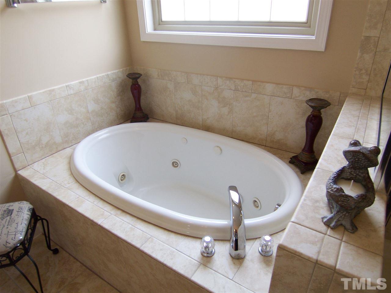 6157 Blakeman Lane Raleigh, NC 27617 - Photo 16 of 25 a bathroom with a sink and mirror