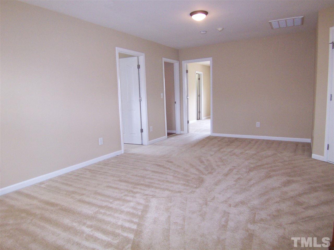 6157 Blakeman Lane Raleigh, NC 27617 - Photo 18 of 25 a view of an empty room