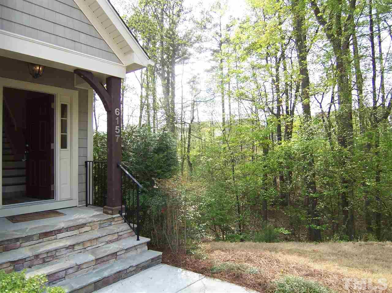 6157 Blakeman Lane Raleigh, NC 27617 - Photo 4 of 25 a view of a house with a backyard