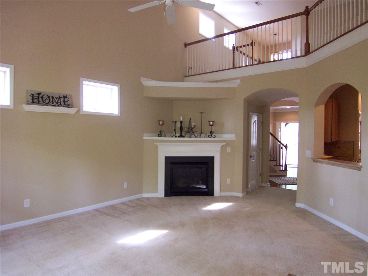 6157 Blakeman Lane Raleigh, NC 27617 - Photo 5 of 25 a view of a livingroom with a fireplace