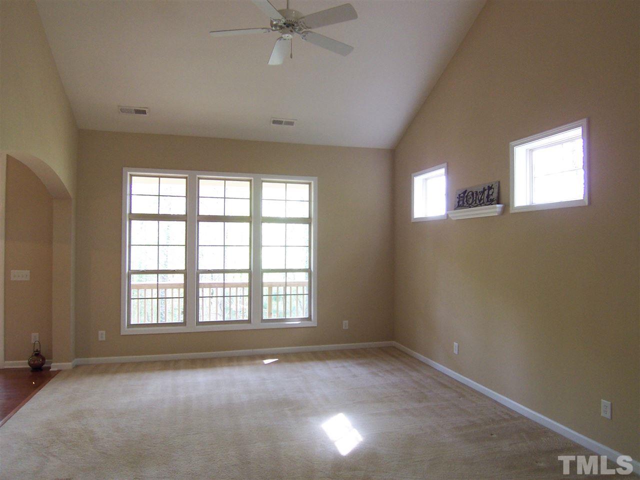 6157 Blakeman Lane Raleigh, NC 27617 - Photo 6 of 25 an empty room with a window