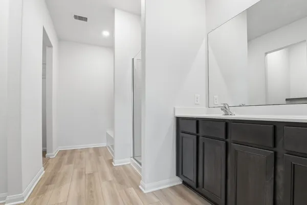 a bedroom with a large bed and a flat screen tv