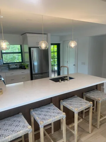 a kitchen with a table and chairs in it