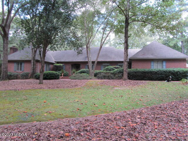 760 Bass Road Macon, GA 31210 - Photo 1 of 44 a front view of a house with a garden and trees