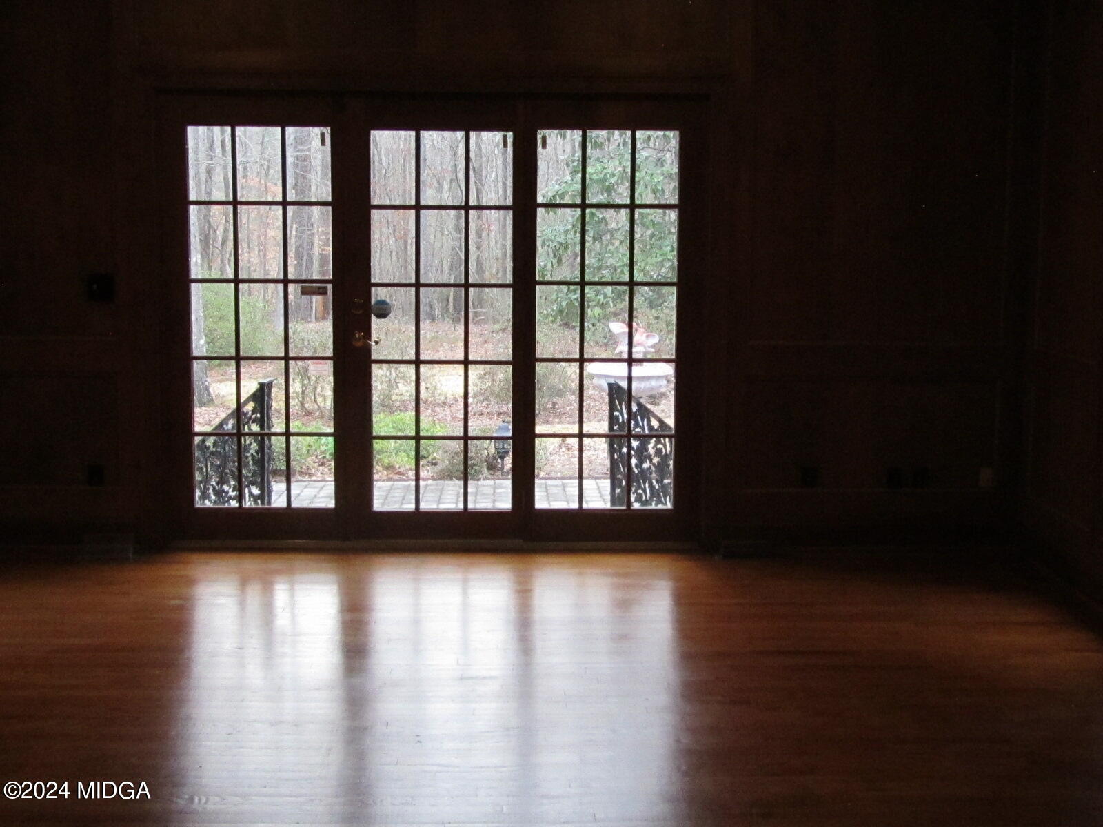 760 Bass Road Macon, GA 31210 - Photo 12 of 44 a view of empty room with wooden floor and fan