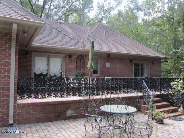 760 Bass Road Macon, GA 31210 - Photo 35 of 44 a front view of house with yard outdoor seating and barbeque oven