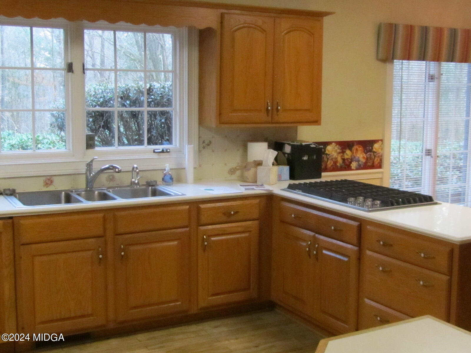 760 Bass Road Macon, GA 31210 - Photo 7 of 44 a kitchen with sink cabinets and window