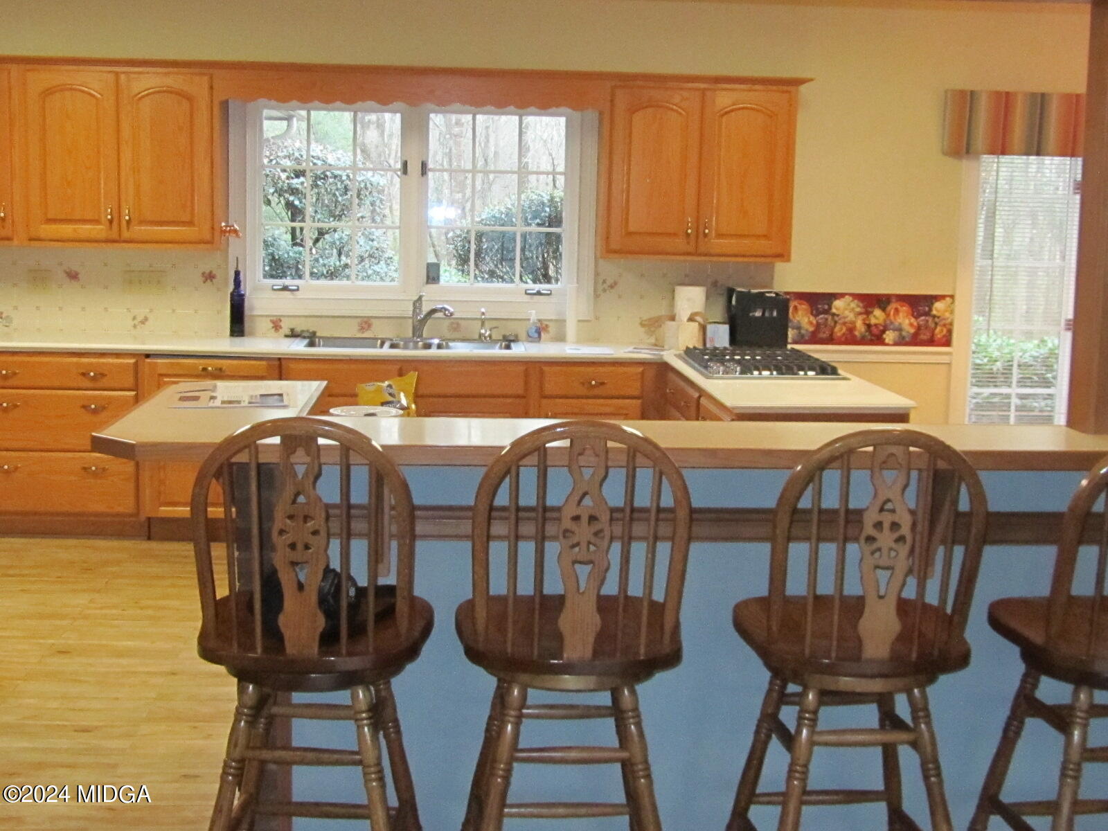 760 Bass Road Macon, GA 31210 - Photo 8 of 44 a table and chairs in a kitchen next to a window