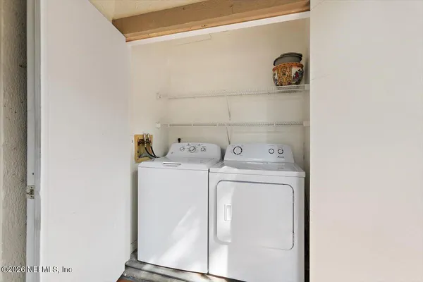 a utility room with dryer and washer