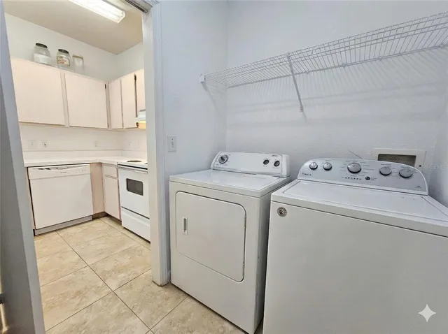 a utility room with dryer and washer
