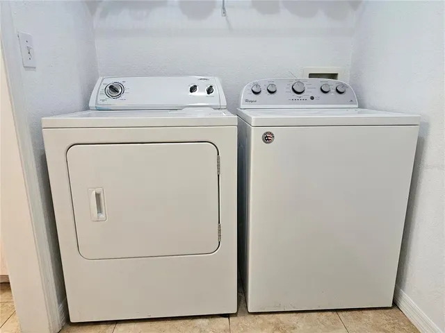 a view of water heater room with a door