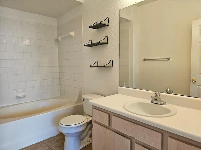 a bathroom with a toilet a sink and a bathtub