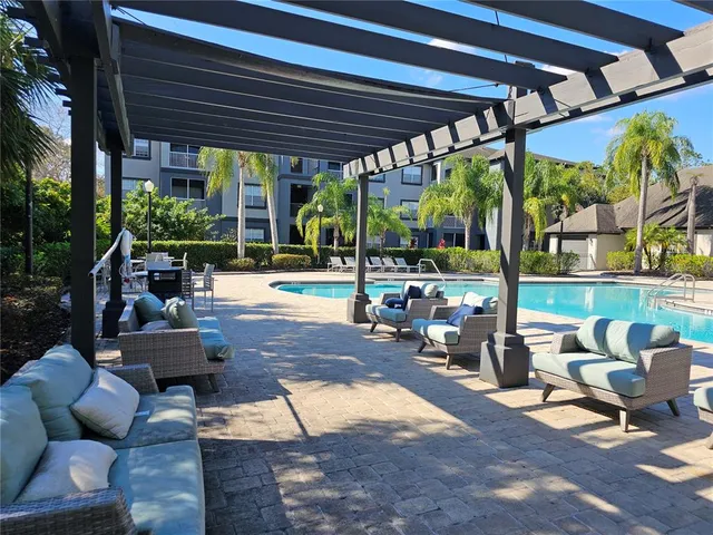 a view of a patio with chairs and a table