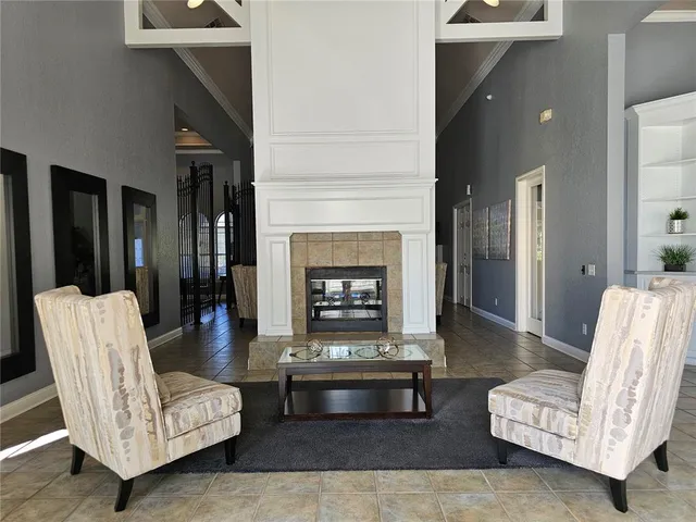 a living room with furniture potted plant and a window