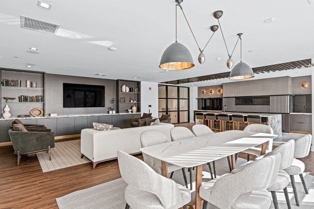 99 Sumner Street, Unit 306 Boston, MA 02128 - Photo 12 of 15 a view of a dining room with furniture