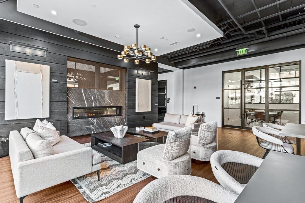 99 Sumner Street, Unit 306 Boston, MA 02128 - Photo 14 of 15 a living room with furniture and a chandelier
