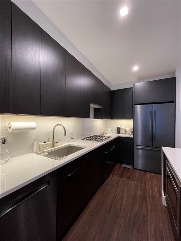 99 Sumner Street, Unit 306 Boston, MA 02128 - Photo 5 of 15 a kitchen with a sink and cabinets