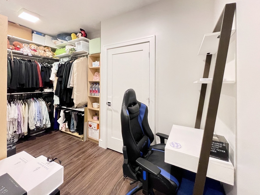 99 Sumner Street, Unit 306 Boston, MA 02128 - Photo 7 of 15 a view of a closet with storage and utility