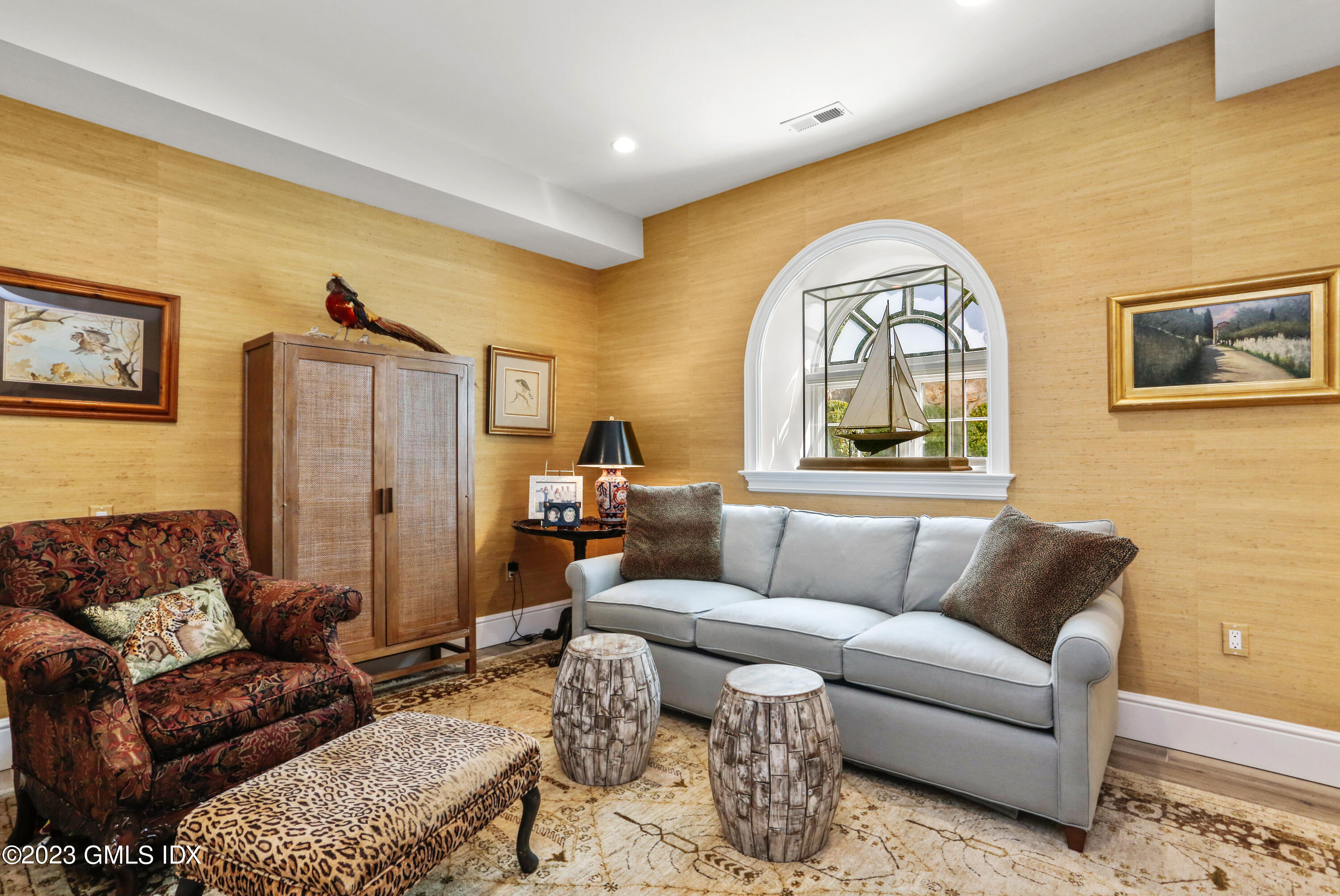 165 Shore Road, Unit A Old Greenwich, CT 06870 - Photo 14 of 28 a living room with furniture and a large window