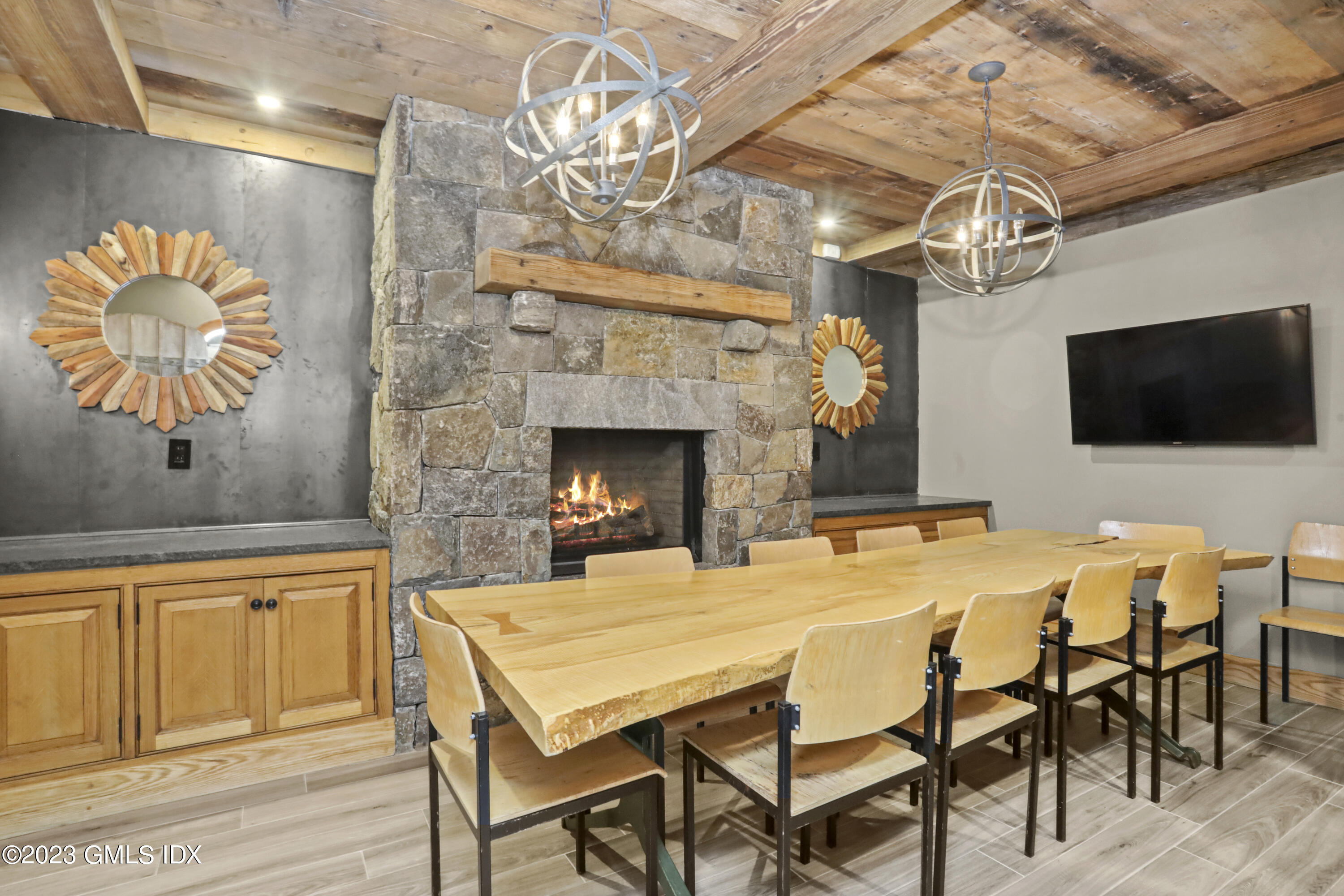 165 Shore Road, Unit A Old Greenwich, CT 06870 - Photo 17 of 28 a dining room with a wooden table and chairs