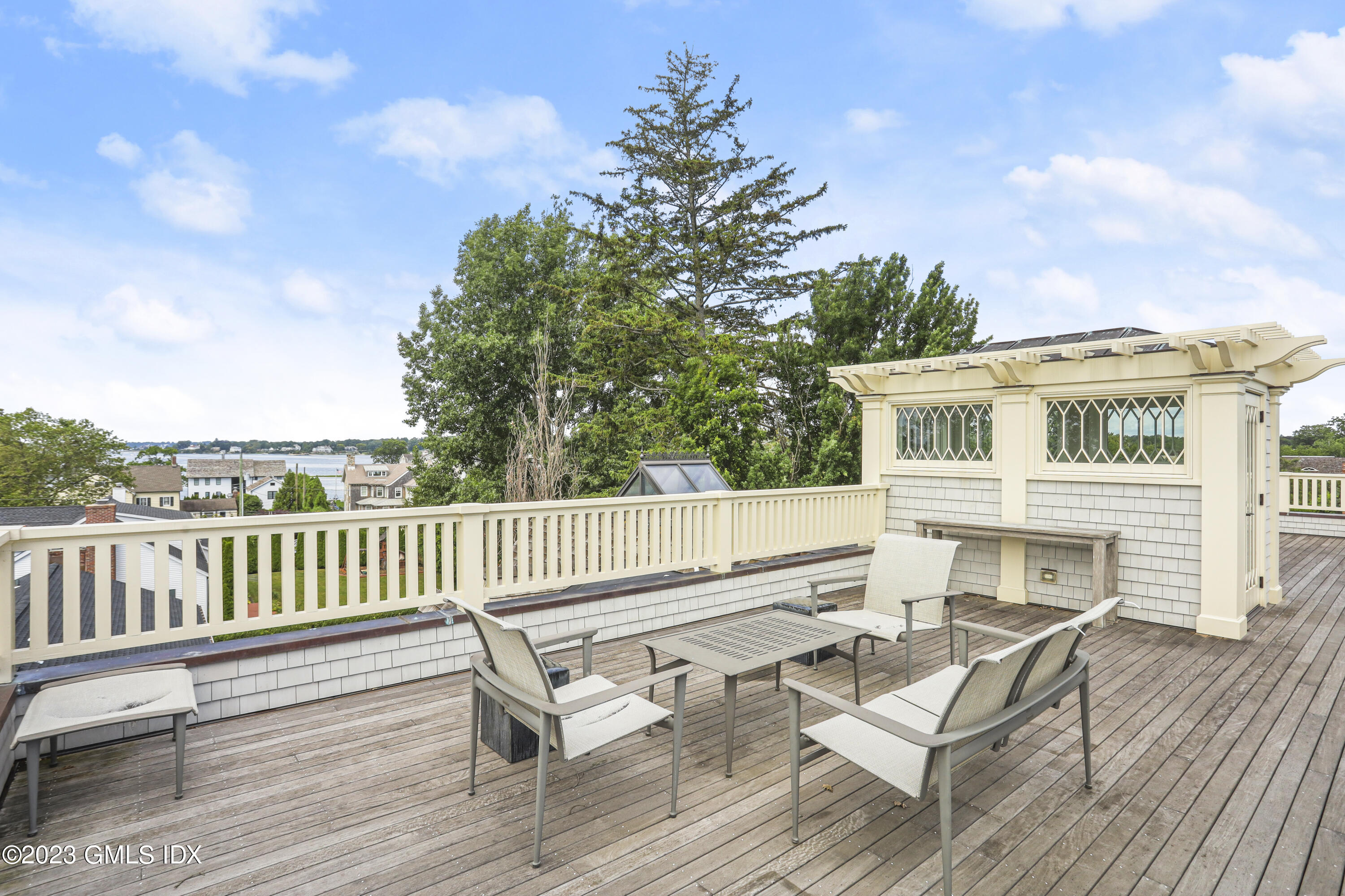 165 Shore Road, Unit A Old Greenwich, CT 06870 - Photo 20 of 28 a view of house with deck and outdoor seating