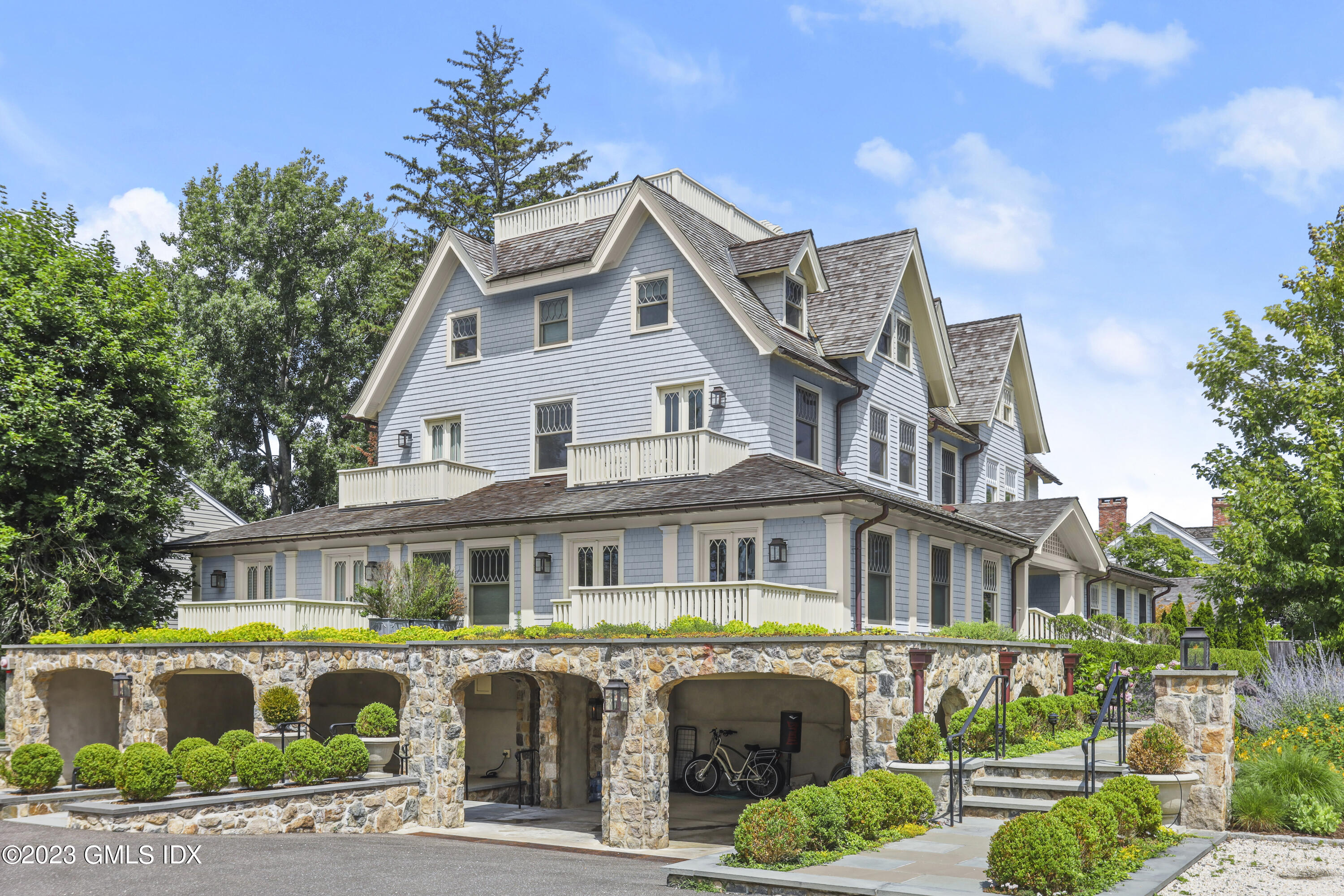 165 Shore Road, Unit A Old Greenwich, CT 06870 - Photo 24 of 28 a front view of a house with garden