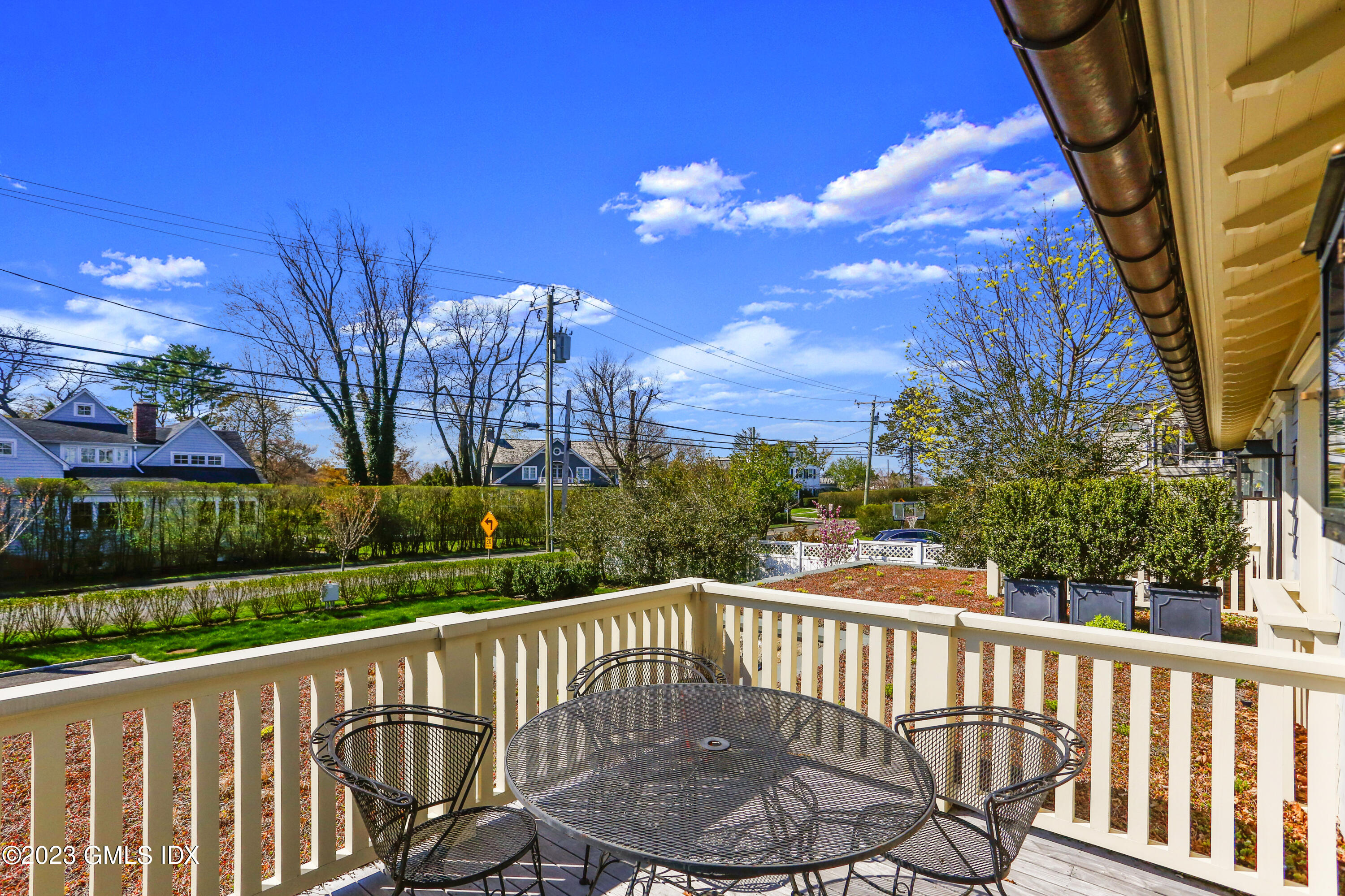 165 Shore Road, Unit A Old Greenwich, CT 06870 - Photo 9 of 28 a view of a deck with a backyard