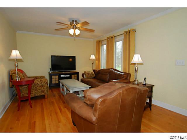 1126 Eastview Drive Charlotte, NC 28211 - Photo 2 of 15 a living room with furniture and a flat screen tv