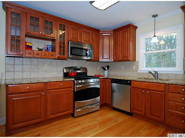 1126 Eastview Drive Charlotte, NC 28211 - Photo 7 of 15 a kitchen with stainless steel appliances granite countertop a sink and cabinets