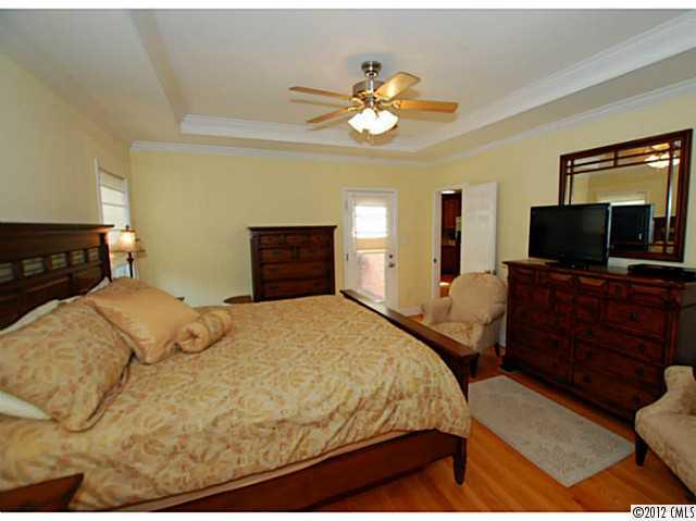 1126 Eastview Drive Charlotte, NC 28211 - Photo 9 of 15 a bedroom with a bed and wooden floor