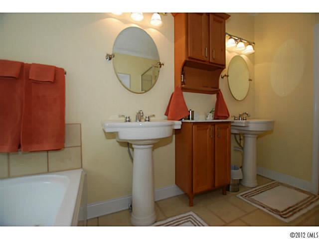 1126 Eastview Drive Charlotte, NC 28211 - Photo 10 of 15 a bathroom with a sink mirror and vanity