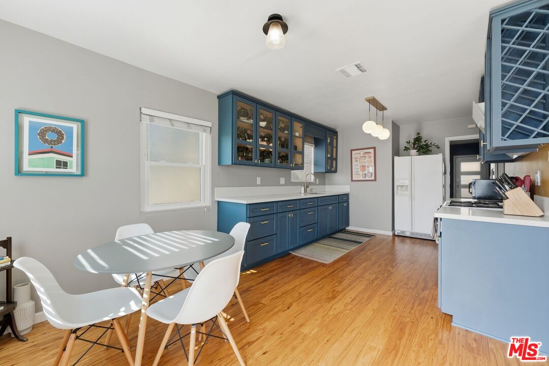 711 Bernard Street Los Angeles, CA 90012 - Photo 3 of 23 a living room with furniture and a flat screen tv