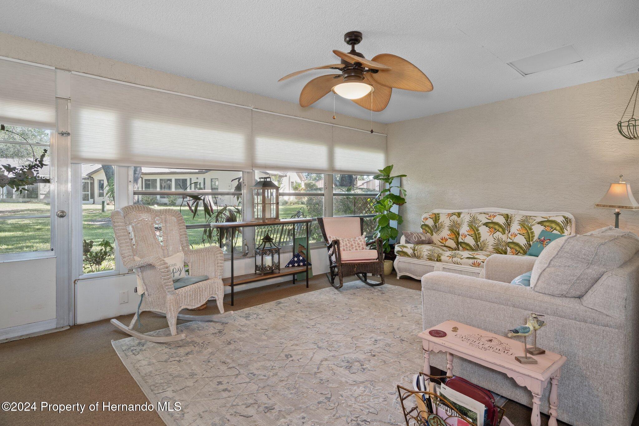 7427 Heather Walk Drive Spring Hill, FL 34613 - Photo 22 of 36 a living room with furniture
