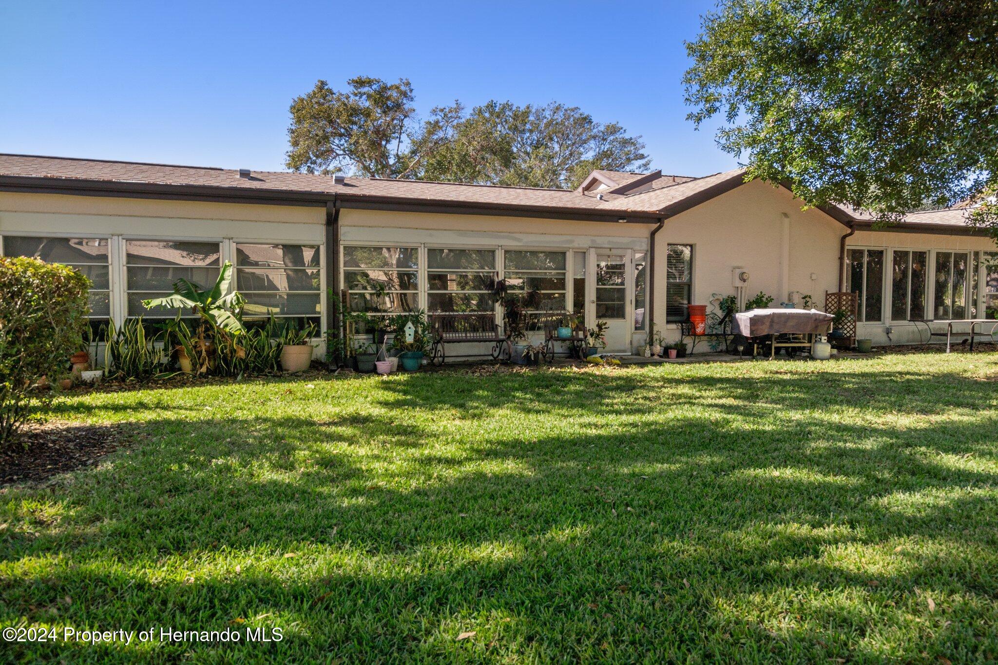 7427 Heather Walk Drive Spring Hill, FL 34613 - Photo 36 of 36 front view of a house with a yard