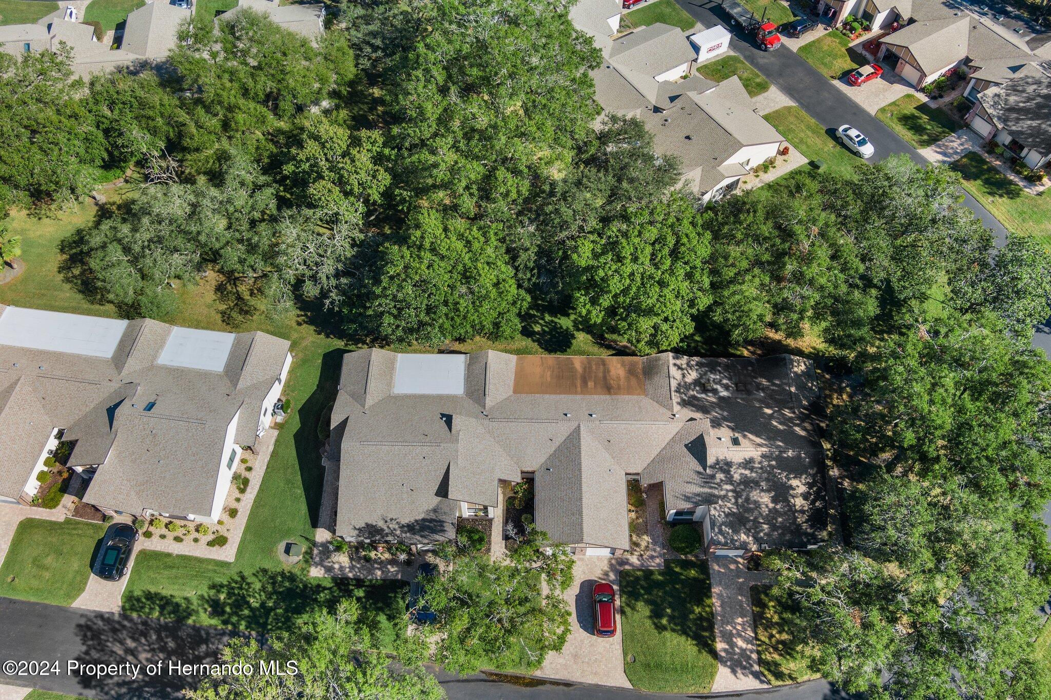 7427 Heather Walk Drive Spring Hill, FL 34613 - Photo 4 of 36 an aerial view of a house