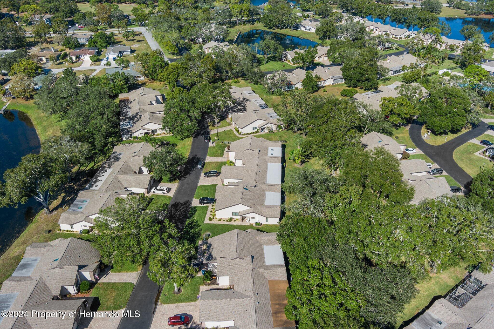 7427 Heather Walk Drive Spring Hill, FL 34613 - Photo 6 of 36 an aerial view of a city