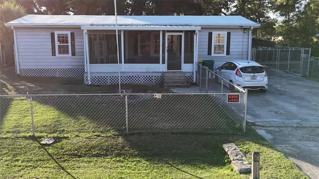 a brick house with a bench in front of it