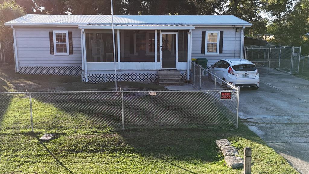 a brick house with a bench in front of it
