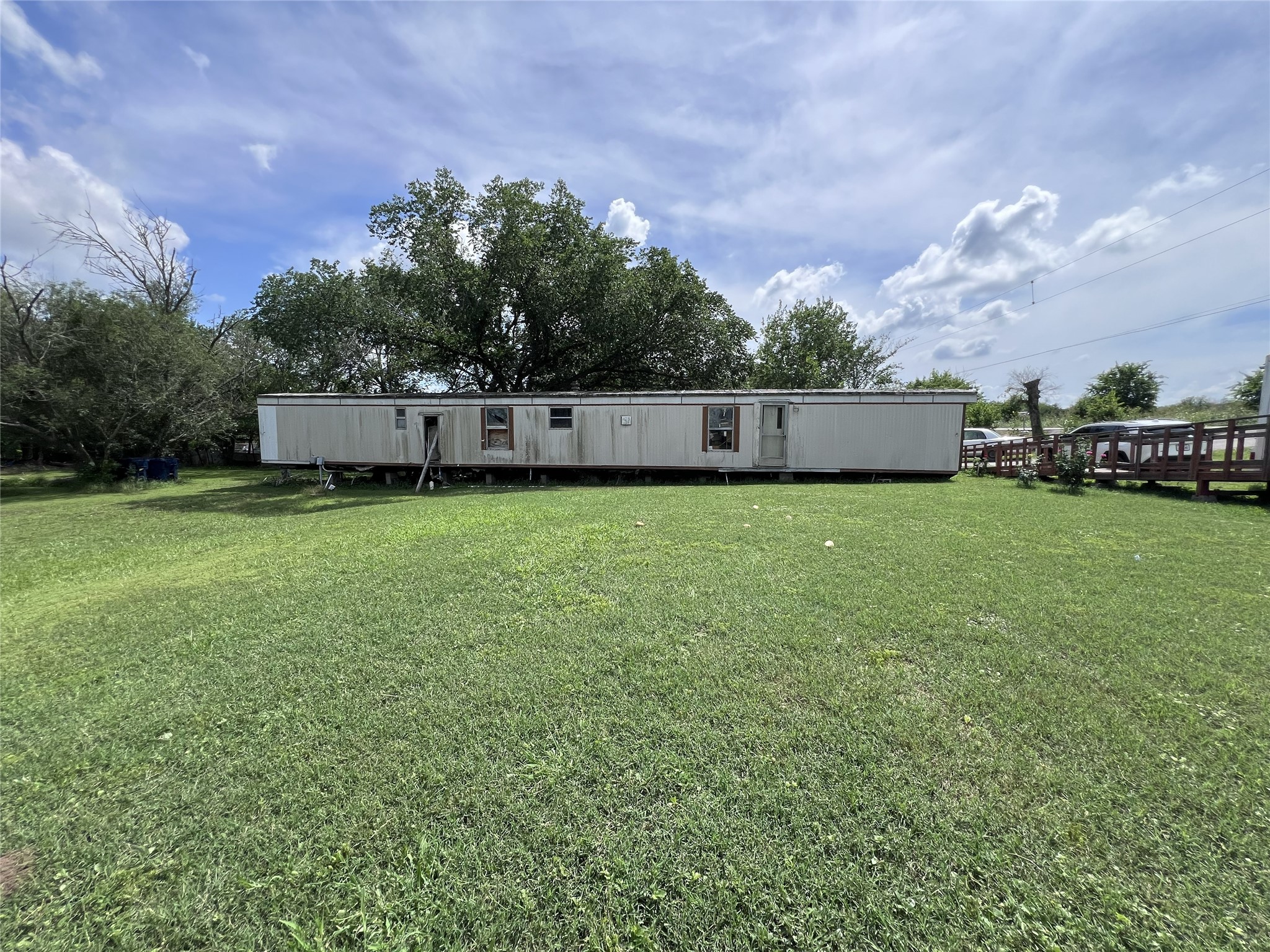 10001 Peterson Road Del Valle, TX 78617 - Photo 18 of 29 a view of a terrace with a yard